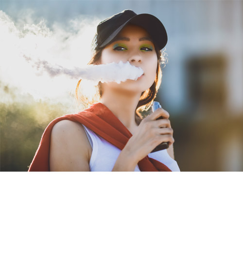 Young woman smoking an e-cigarette