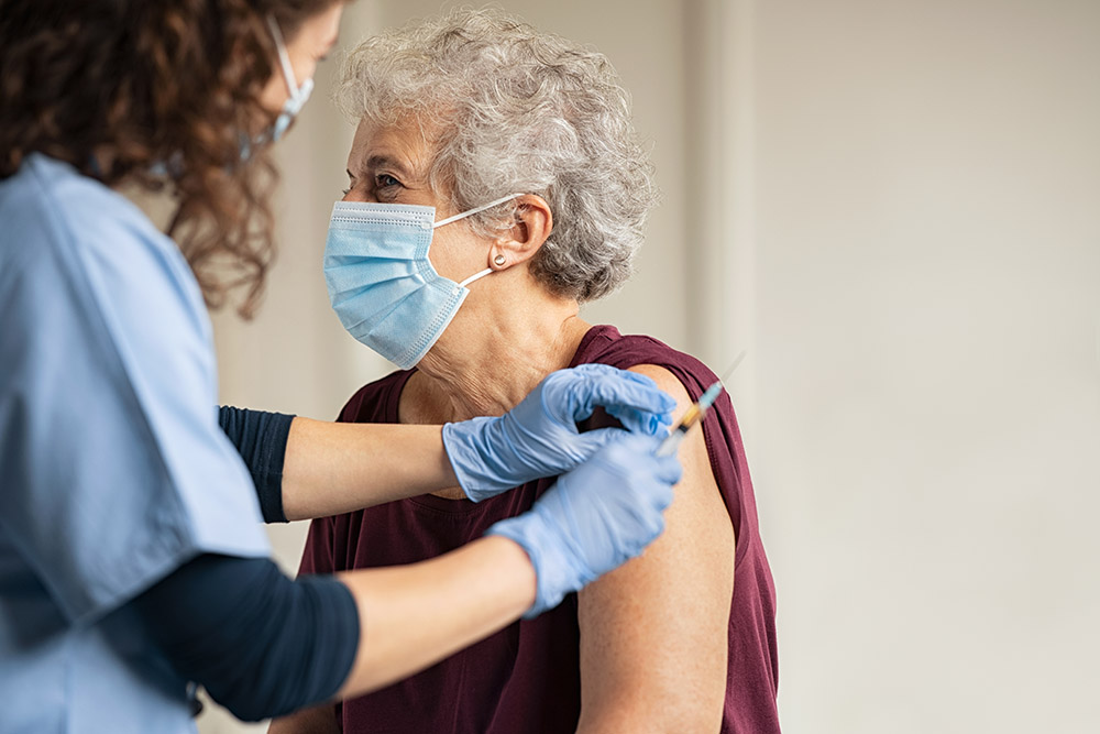 Elderly woman gets Covid vaccine