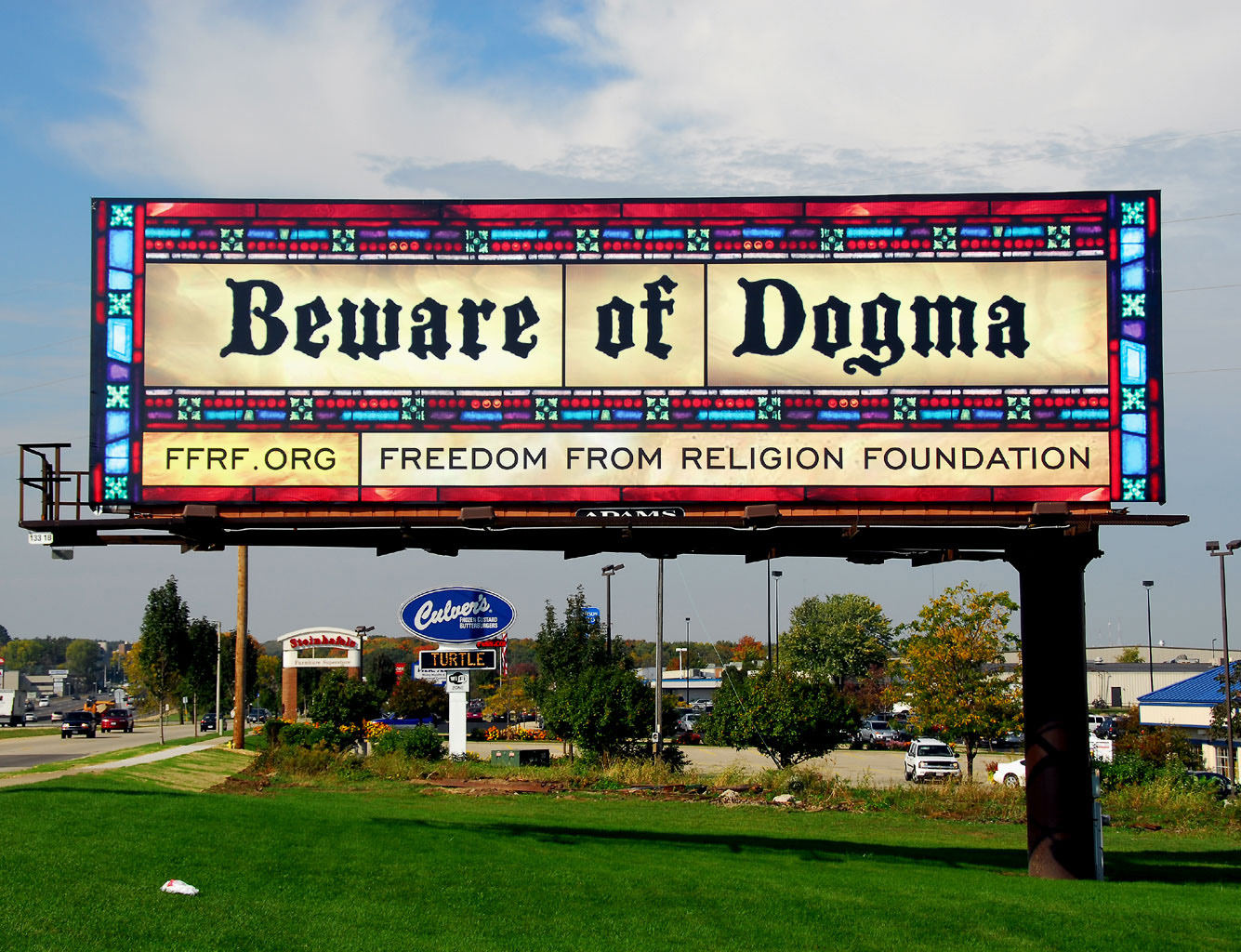 Beware of Dogma on a sign