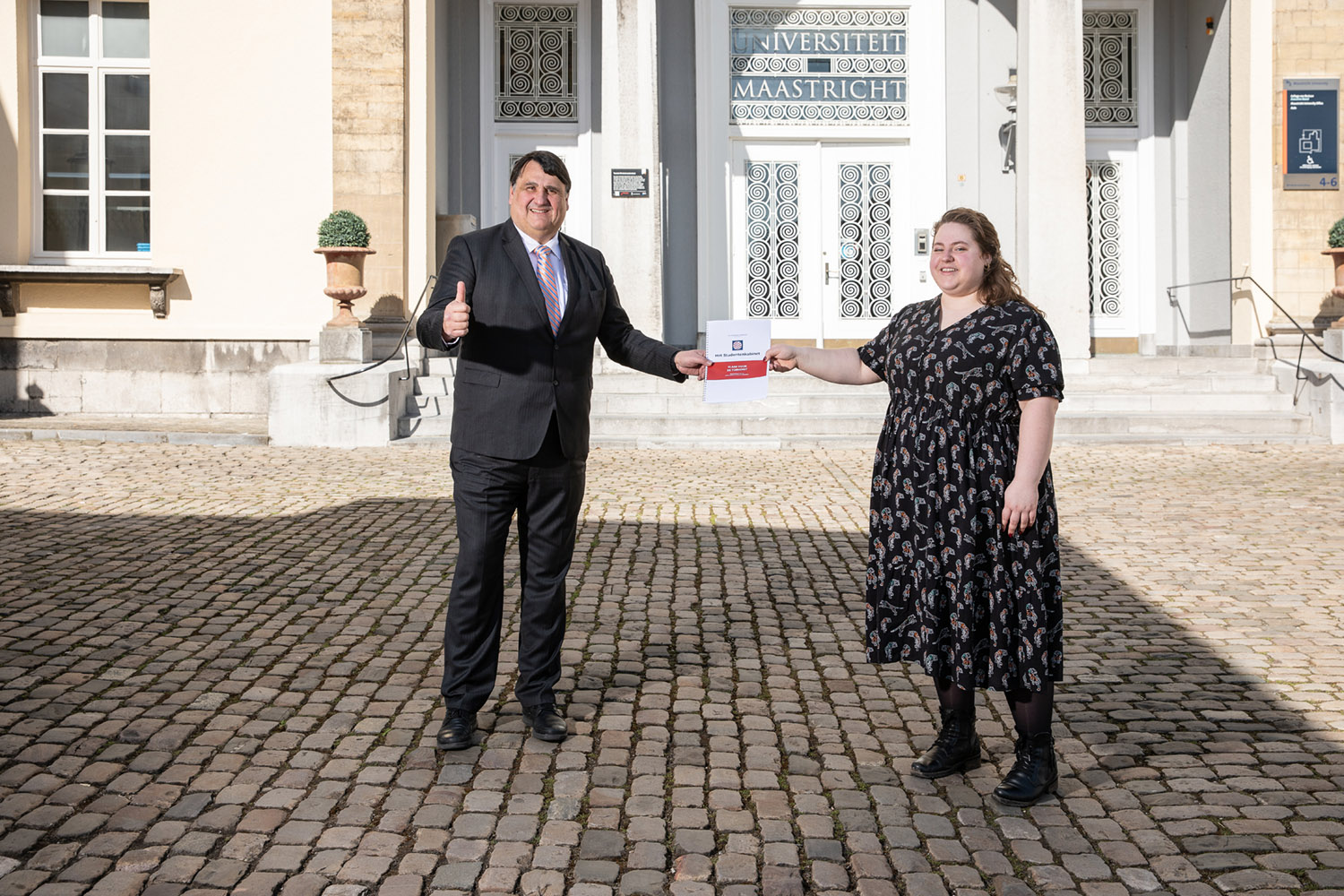 Student cabinet member Heleen van der Velden with UM president Martin Paul