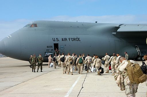 US Navy board a plane to deploy to the 5th fleet area of responsibility_in_support_of_the_global_war_on_terrorism