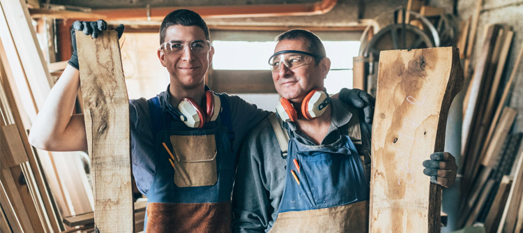 Father and son in their carpenter's workshop