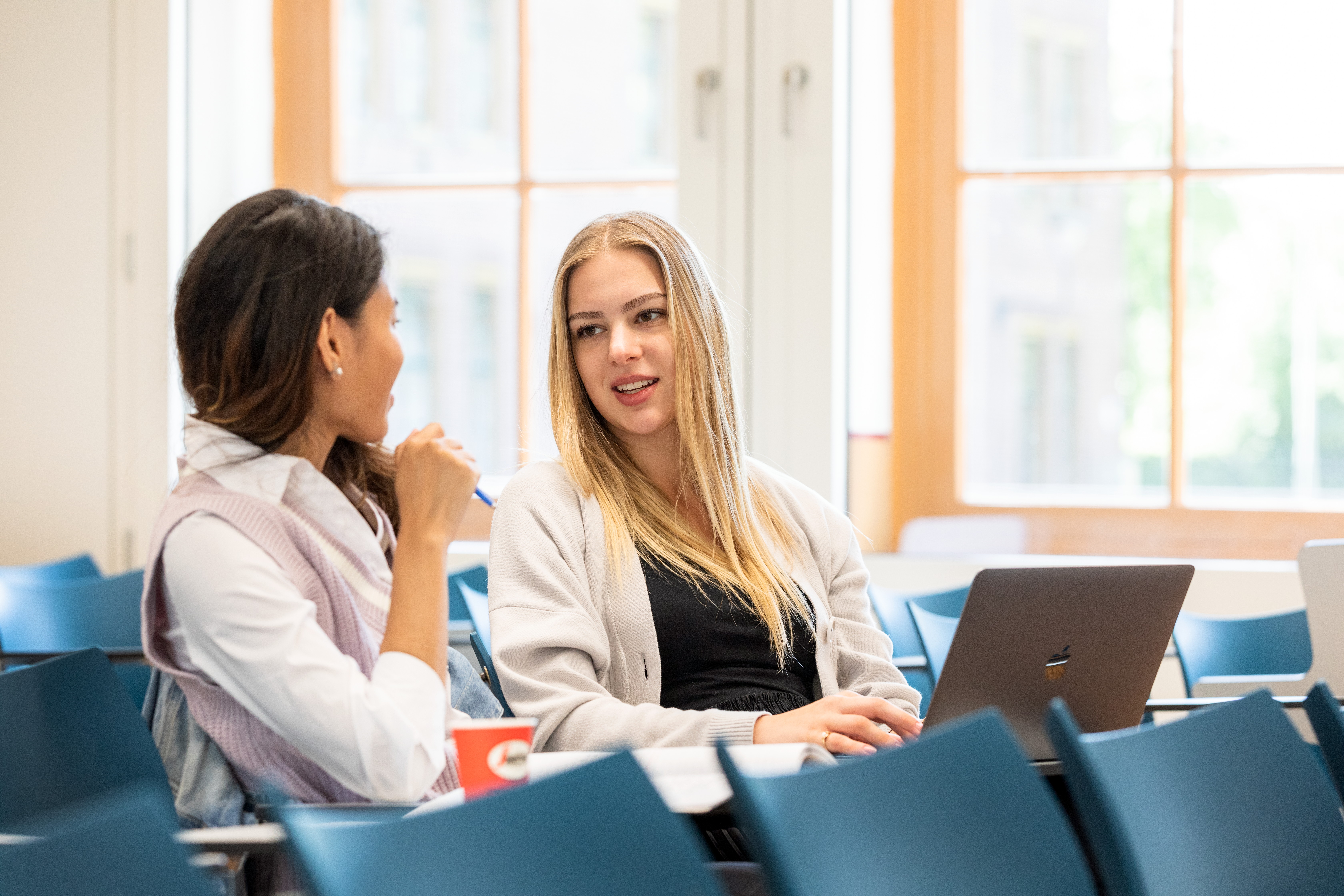 Talking students in lecture hall