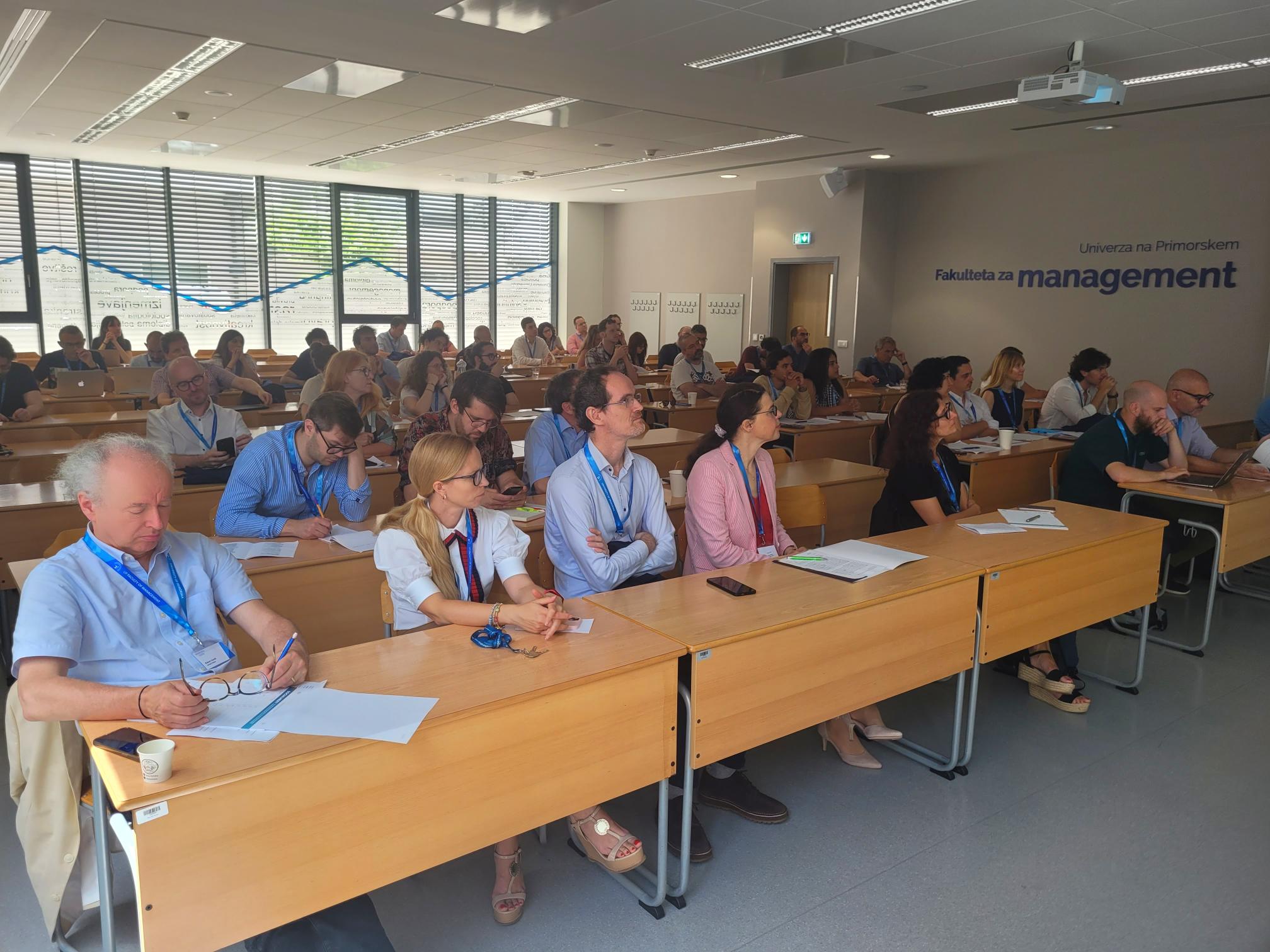 A lecture hall filled with people