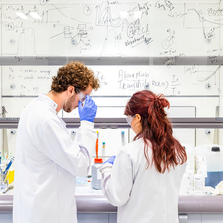Two students working in a lab