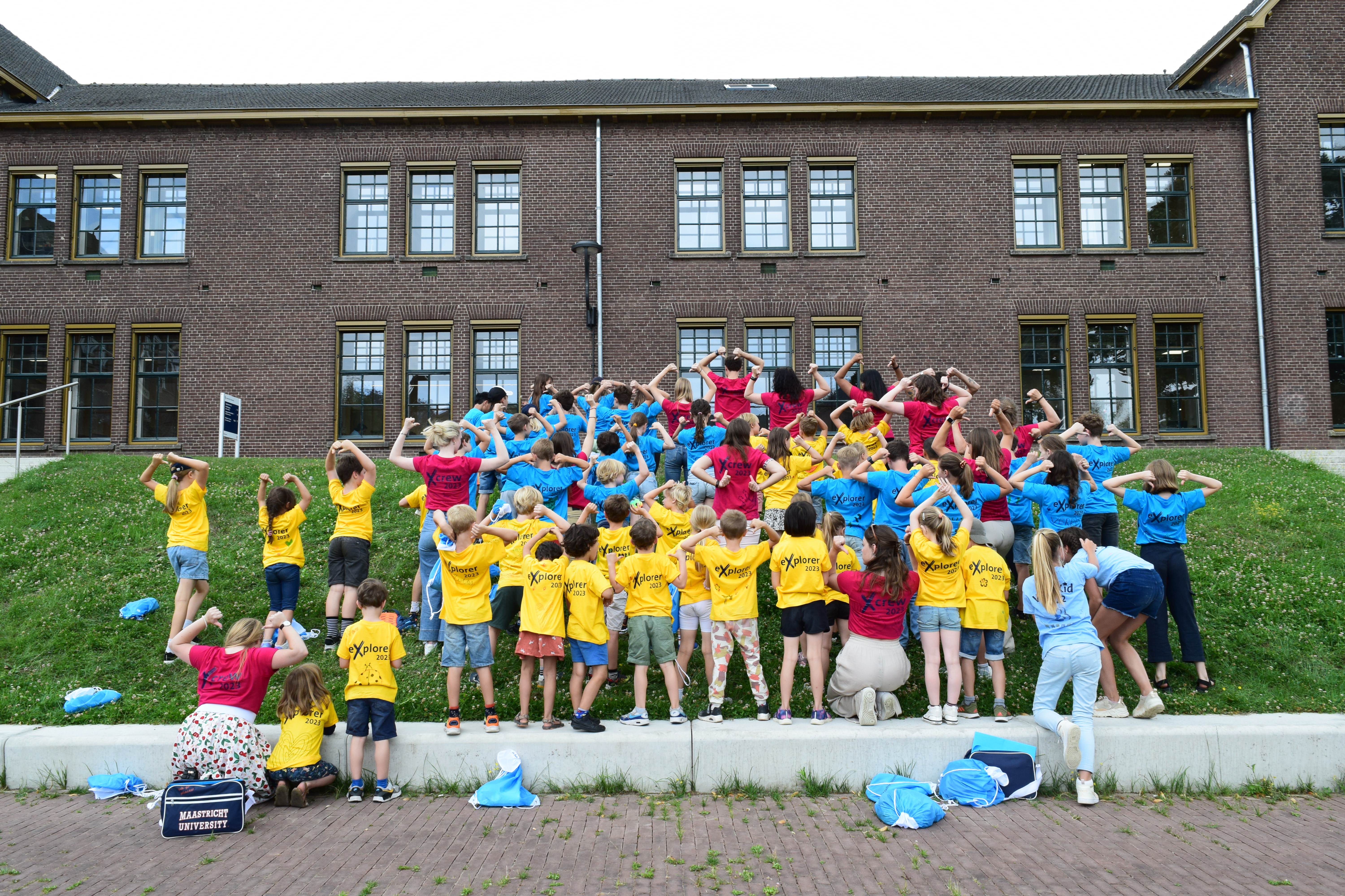 Summer Camp 2023 participants and crew in bright colored shirts