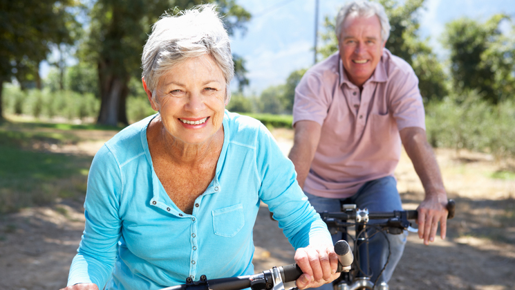 seniors riding a bike
