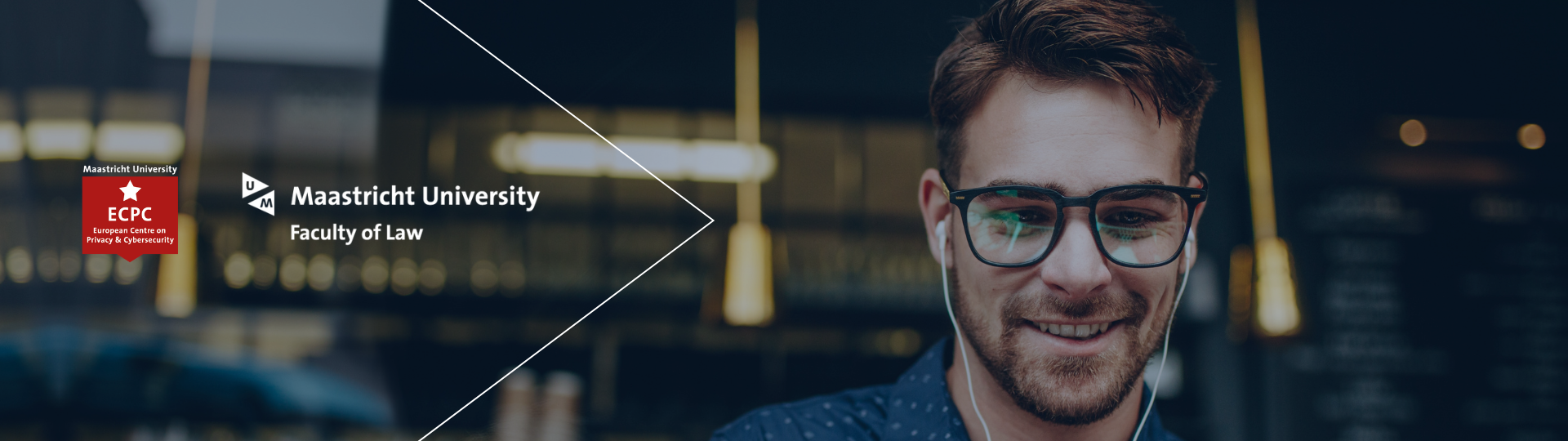banner of man with earphone smiling at a screen 
