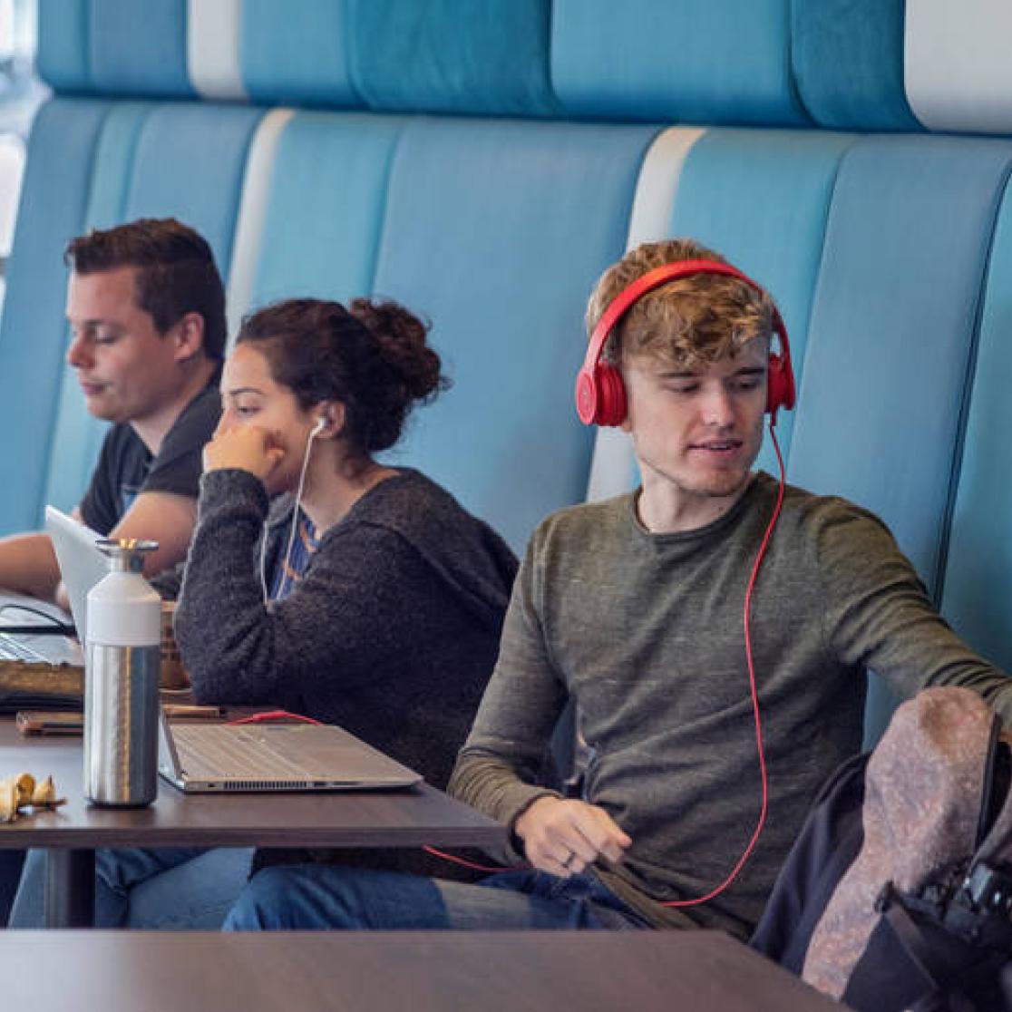 Students studying in the student canteen of Maastricht University