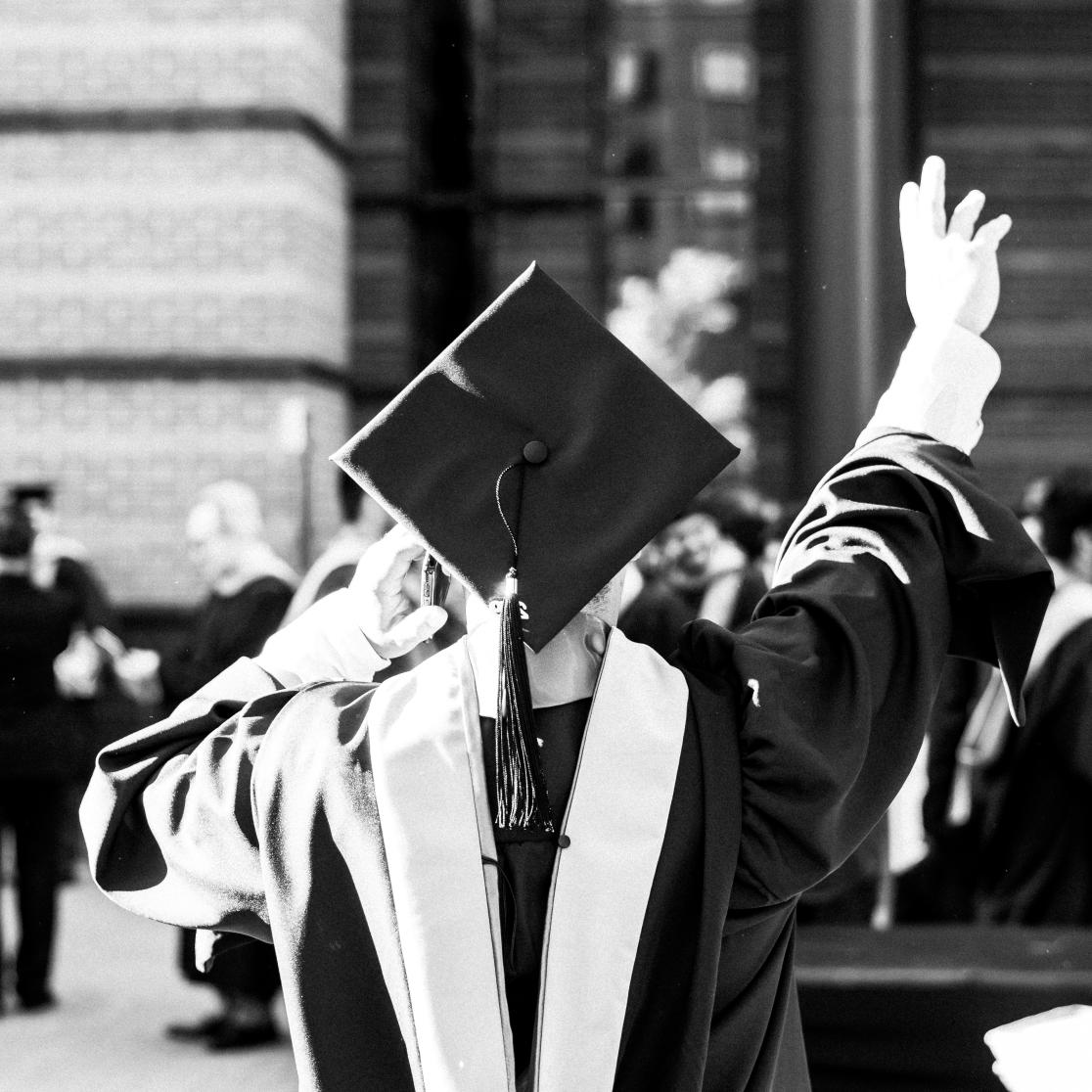 greyscale-photography-of-person-wearing-academic-dress 
