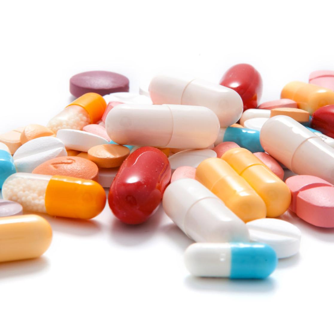 Various pills on a white surface