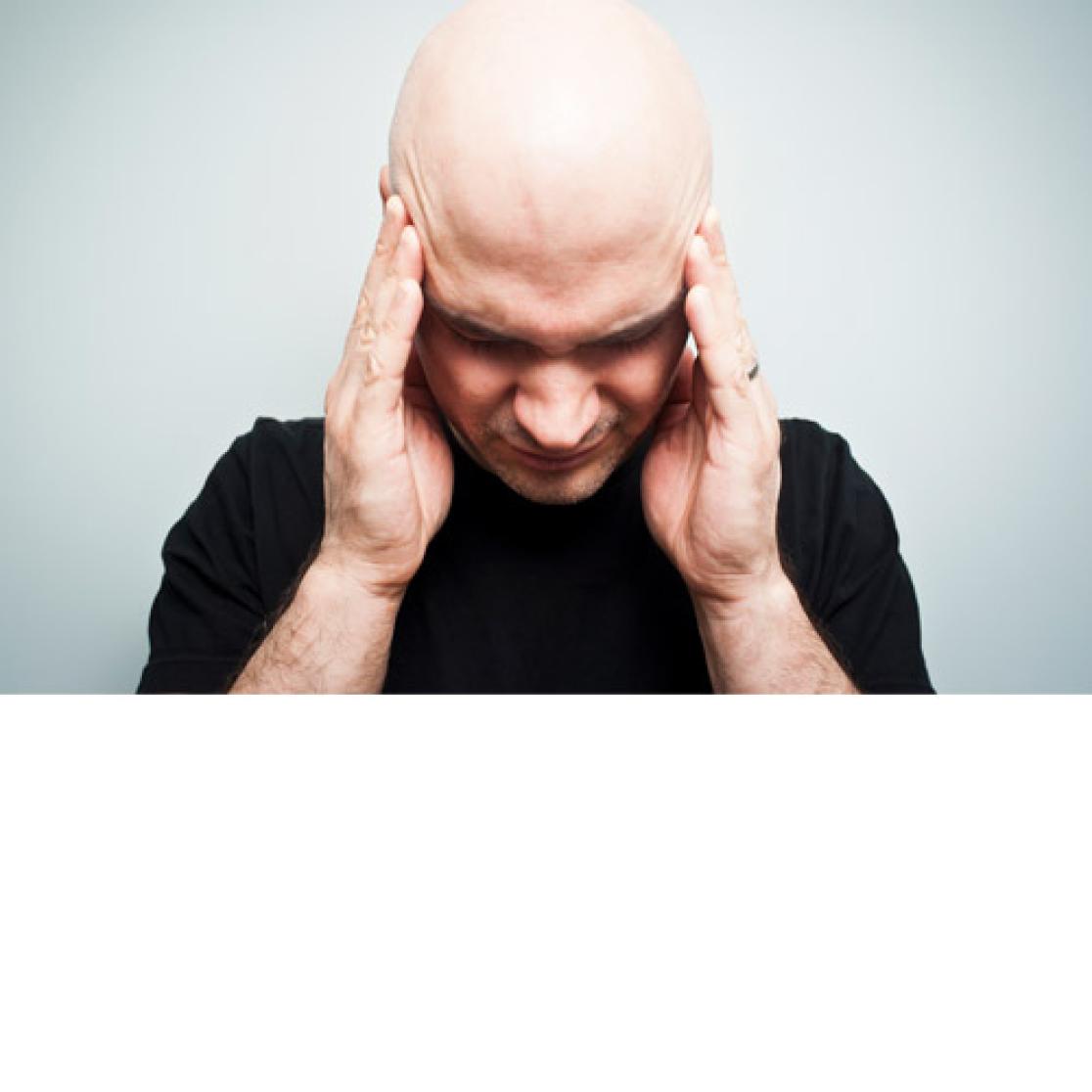 Man holding his head in distress