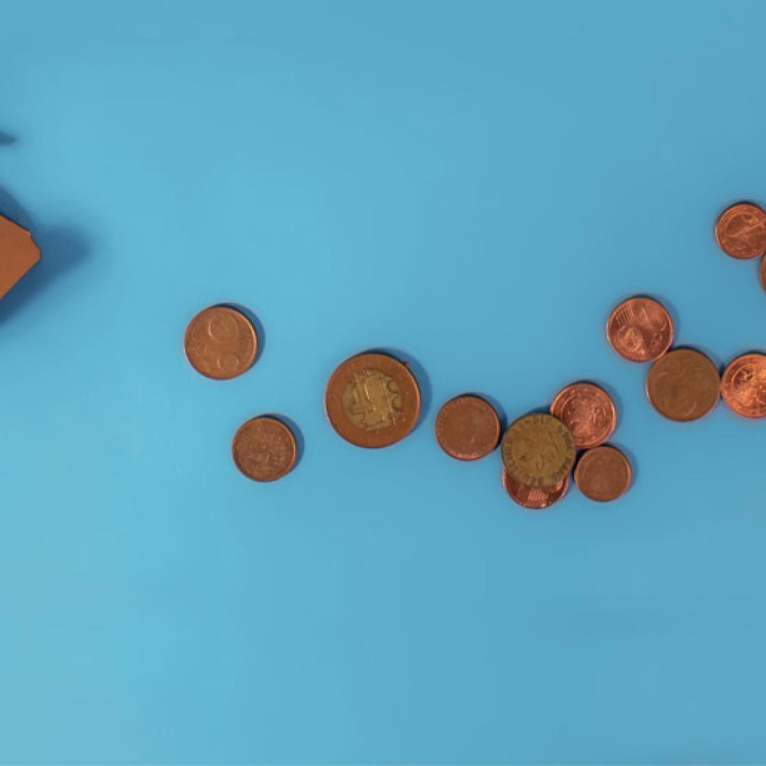 Broken piggy bank with euro coins