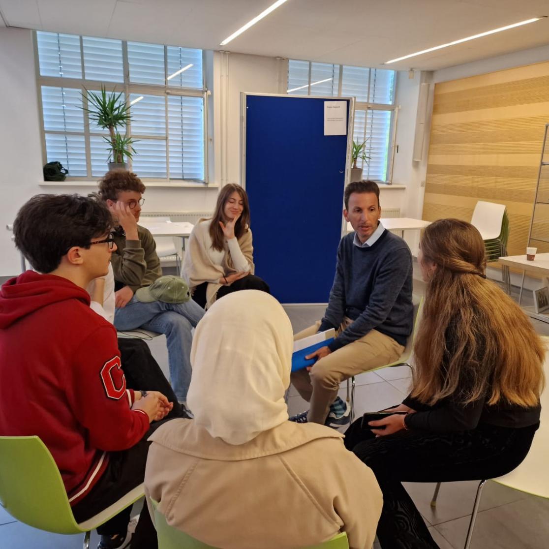 Anthony together with students