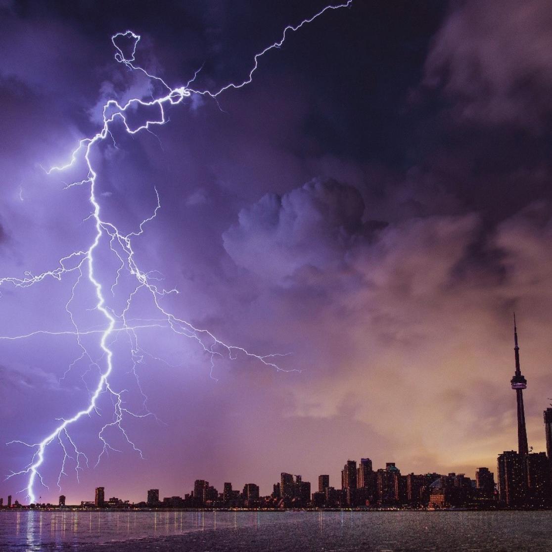 lightning strike next to a city