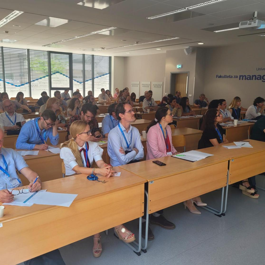 A lecture hall filled with people
