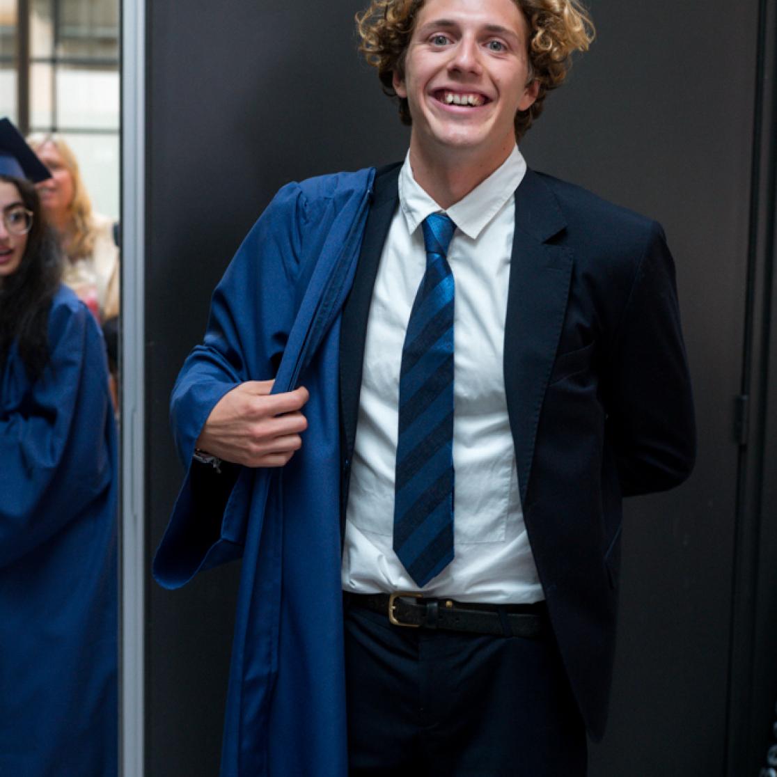 Francesco Ferrari puts on his gown