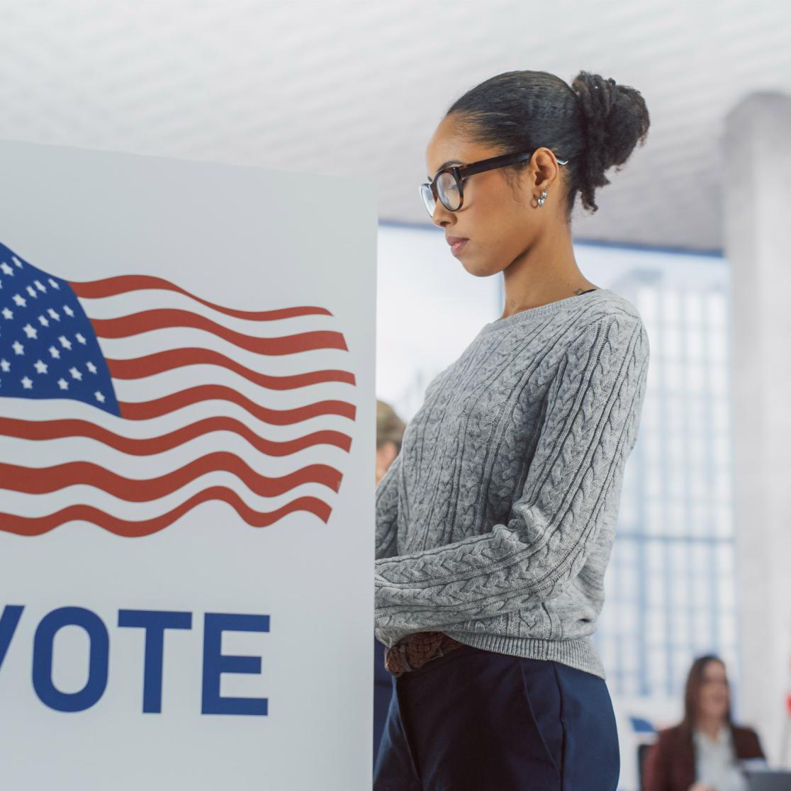 Young woman casting her vote during US elections