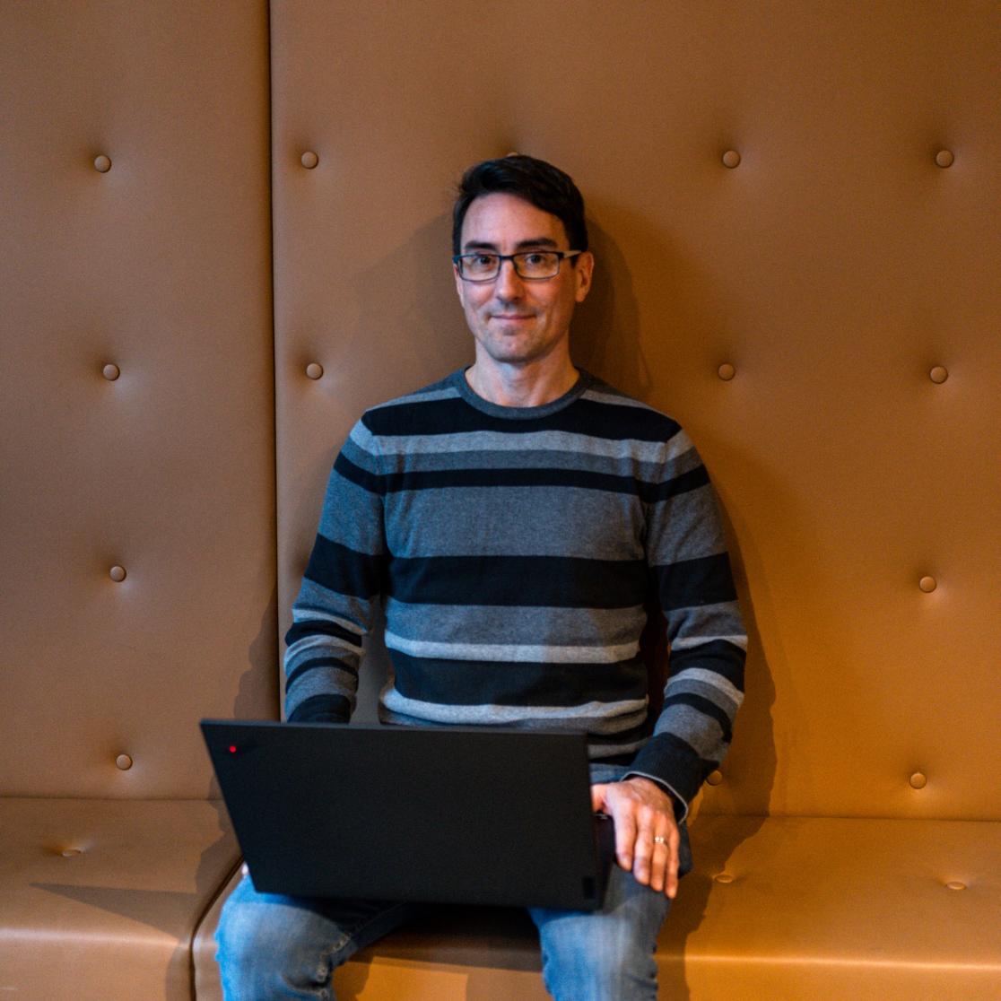 Michel Dumontier sitting with his laptop