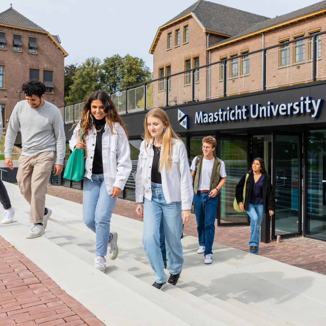 Group of students in front of Maastricht University School of Business and Economics building at Tapijn