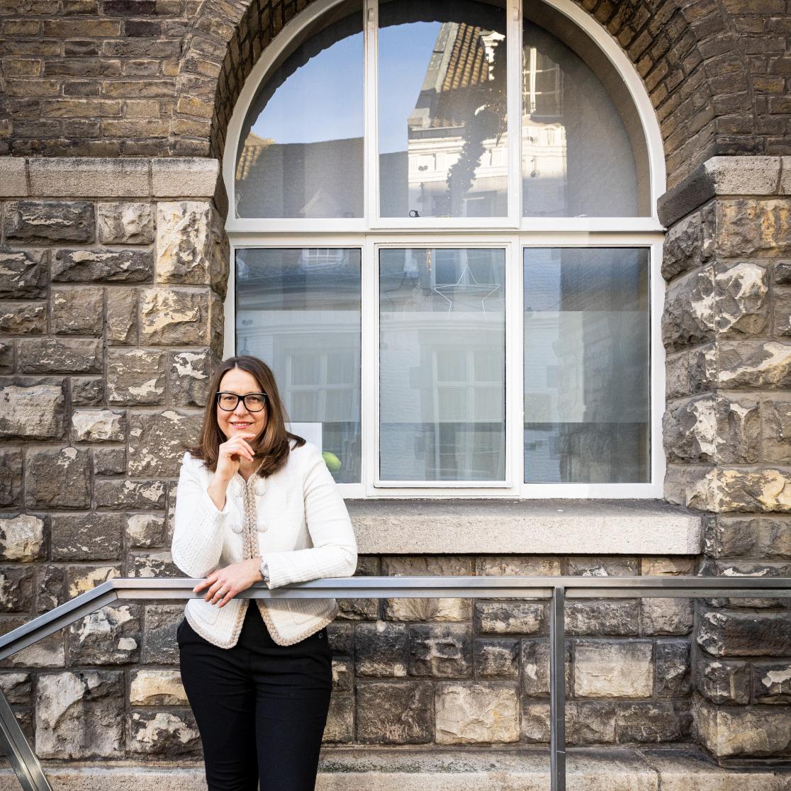 Professor Maja Brkan against fence
