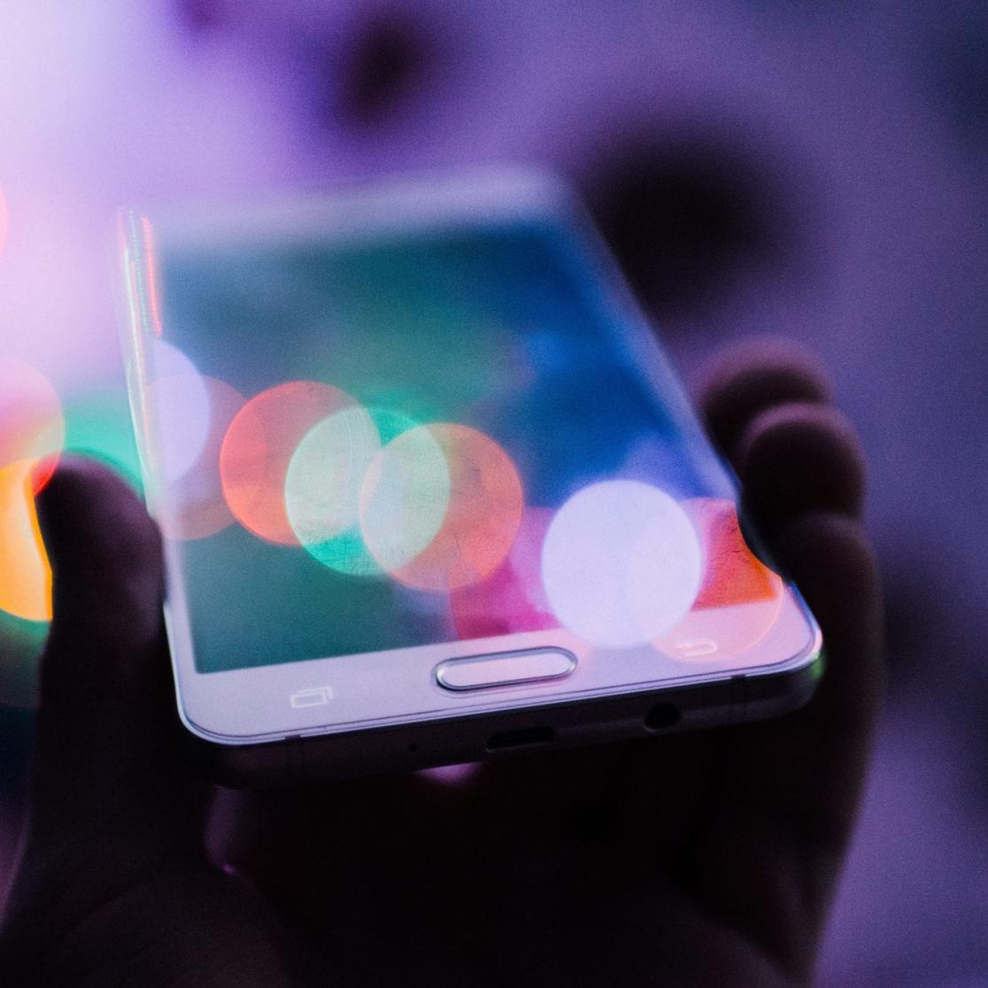 Smartphone in hand photo by rodion-kutsaiev