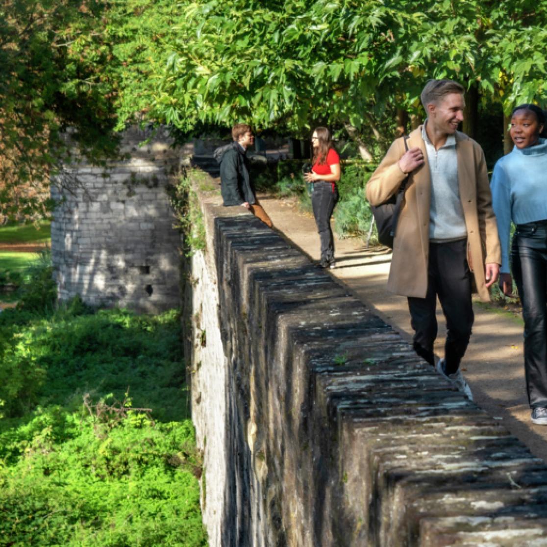 Students walking on wall