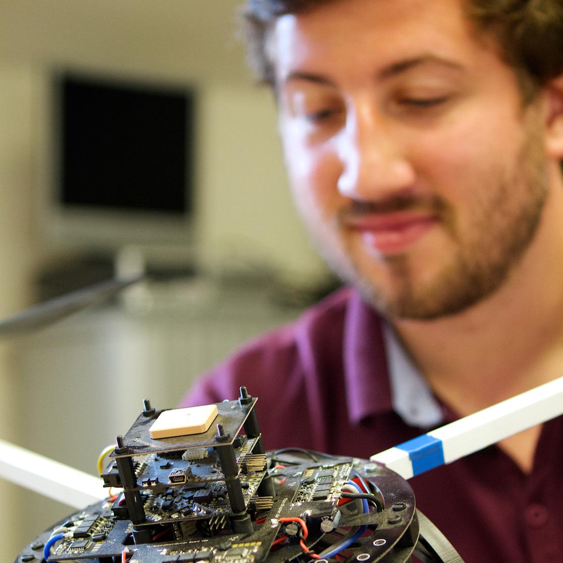 Student holding drone