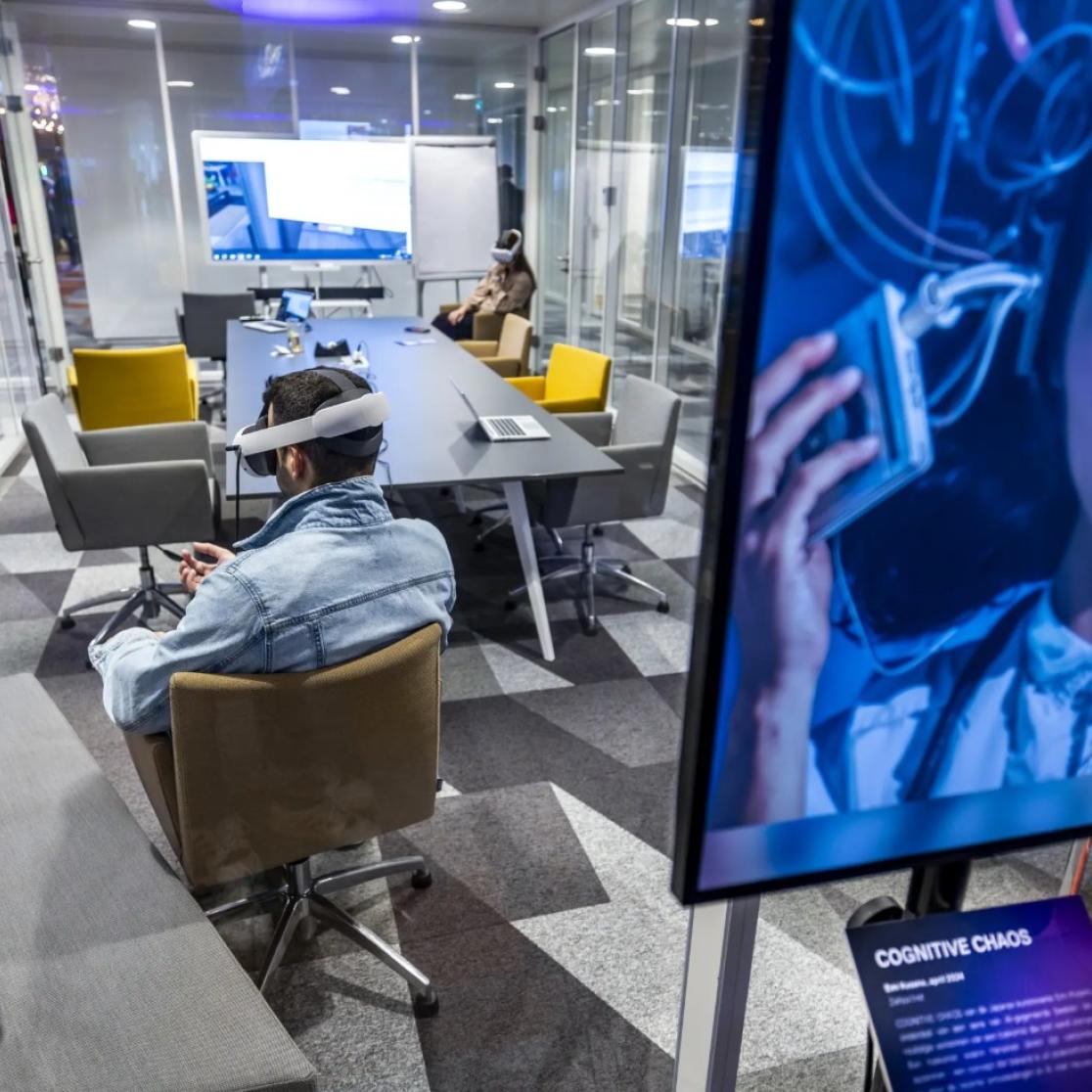 People in meeting room with AI VR glasses