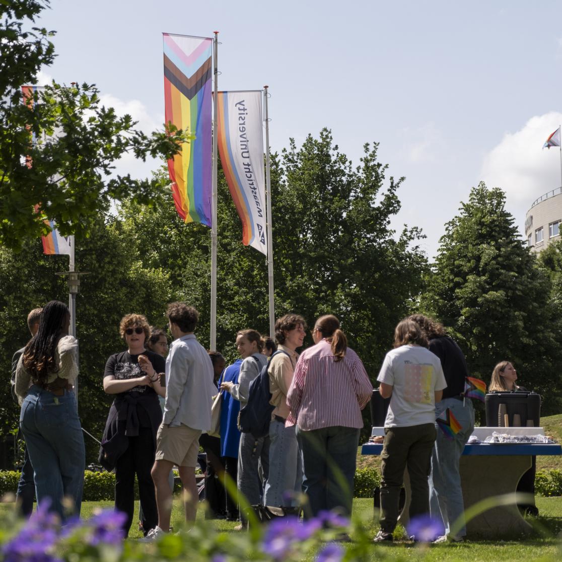 Staff and students talking about Pride month at Pride Month flag raising event