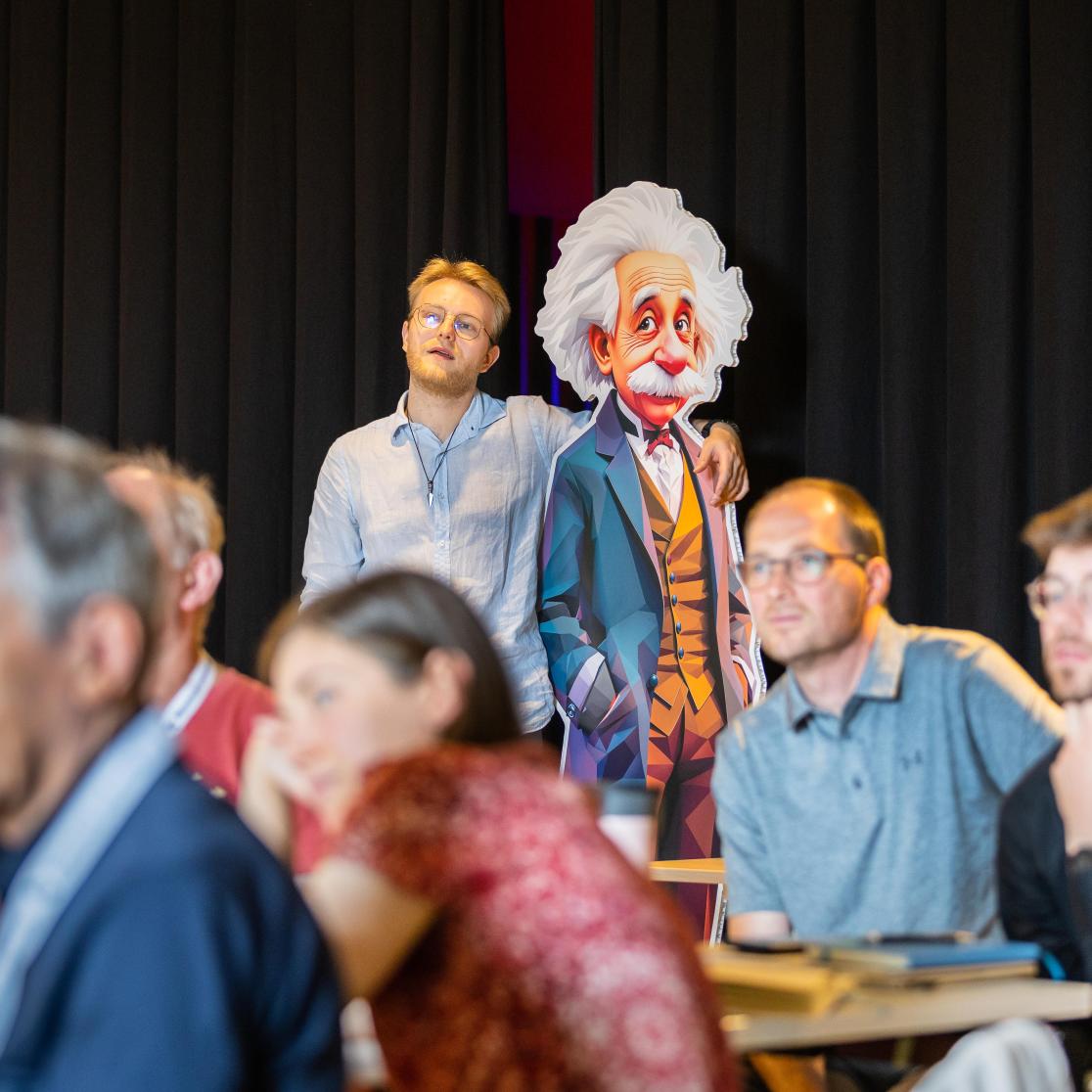 teacher embracing Einstein statue during Magic summer school