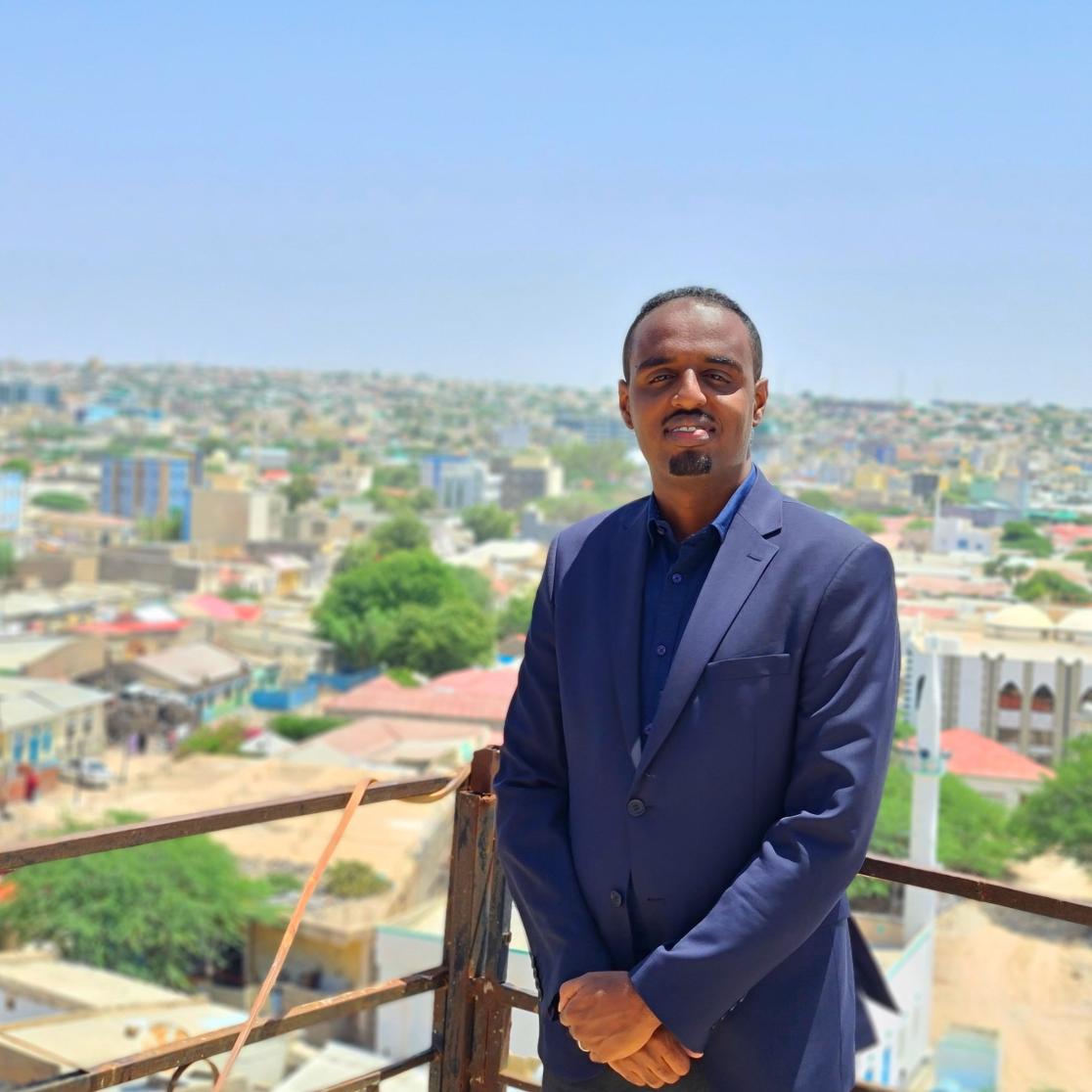 Guleid Ahmed Jama on a balcony