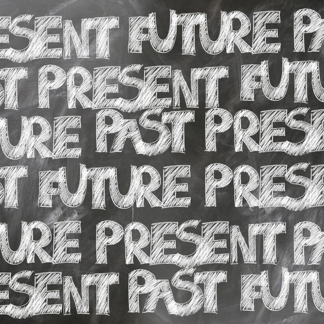 chalk bord saying present future past
