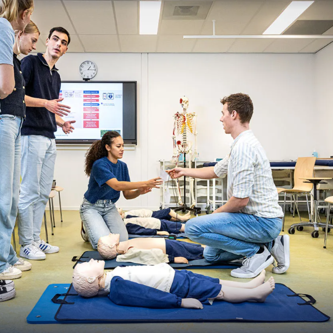 A group of medical students practicing