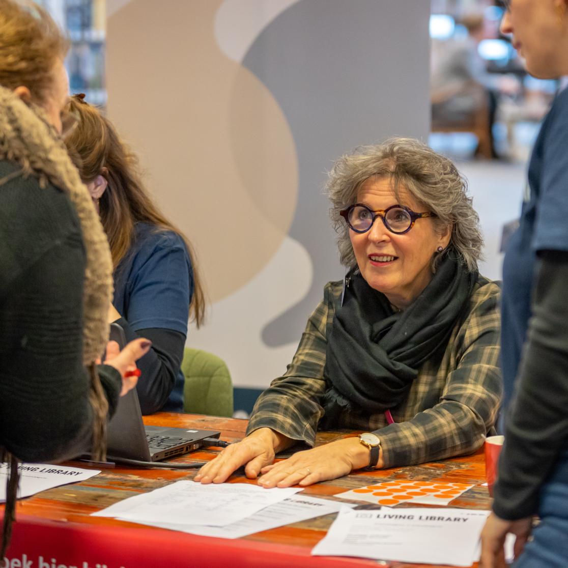 Living Library volunteer registering readers