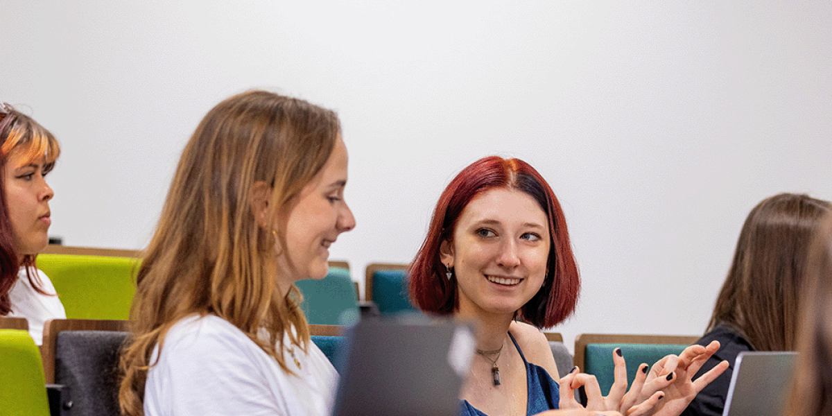 Students having a casual conversation in class