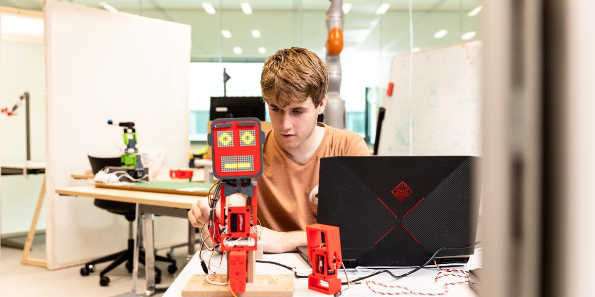 Guy programming robot