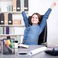 Work Health and Career: woman in office stretching out