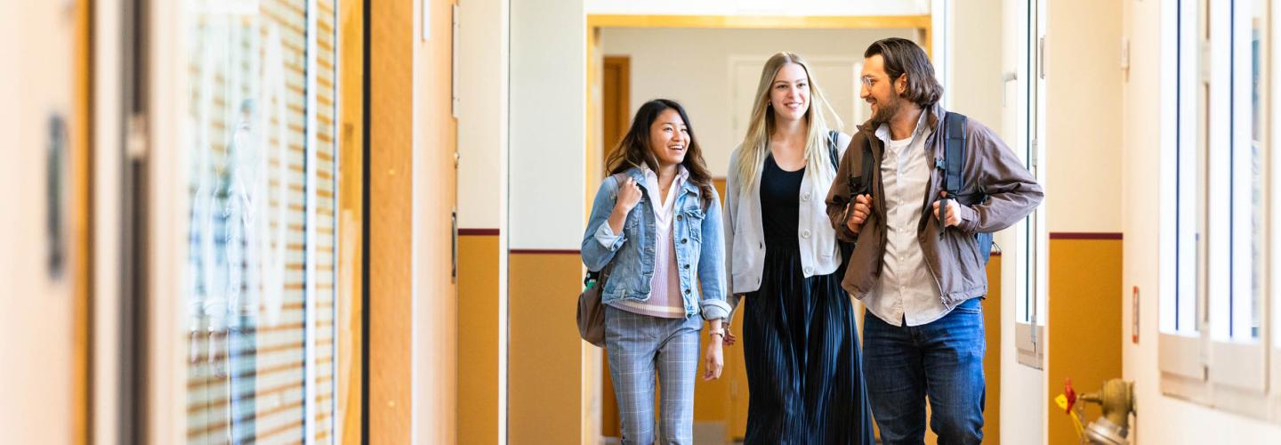 Sbe students walking in MSc building at Tapijn