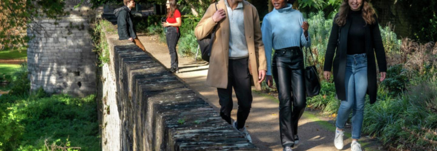 Students walking on wall