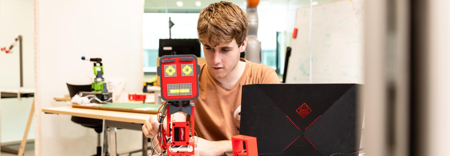 Guy programming robot