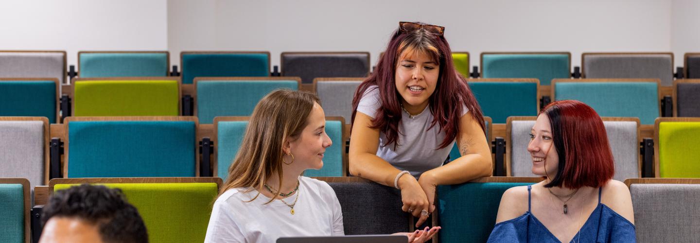Student chatting in lecture hall