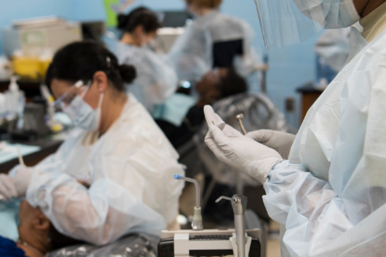 Doctors in white coveralls