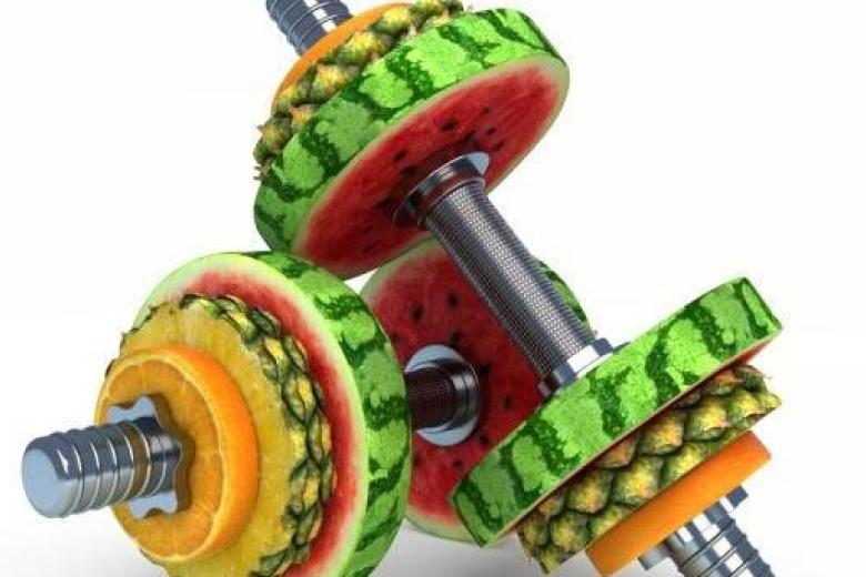 Dumbbells with fruits as weights