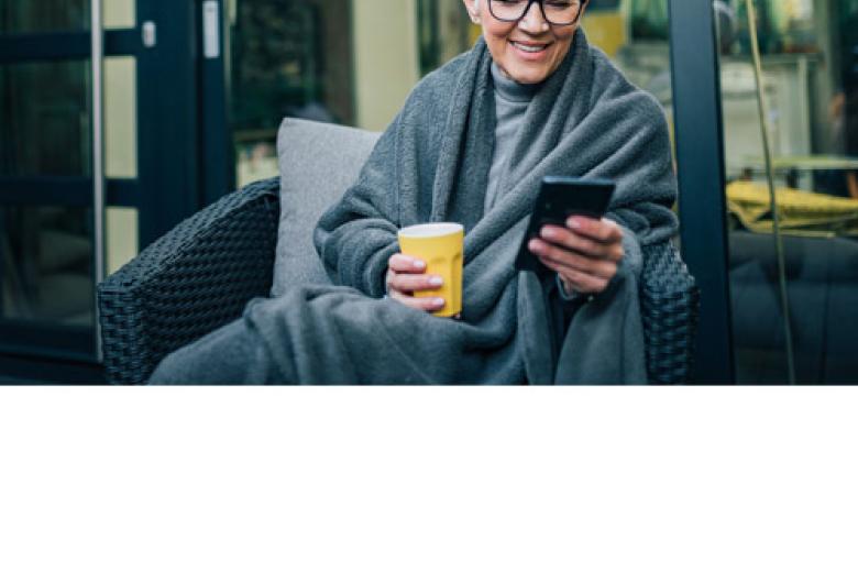 Lady is looking at her smartphone