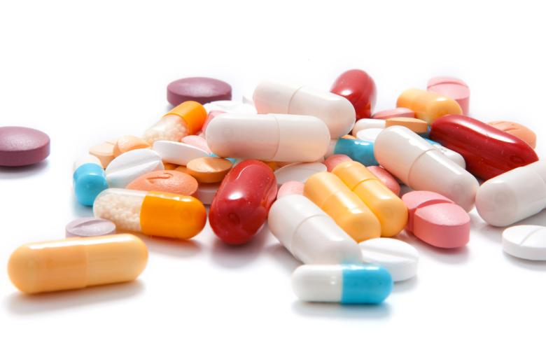 Various pills on a white surface