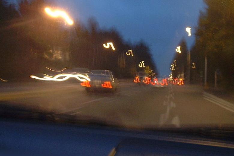 Vague view of traffic on road through windshield