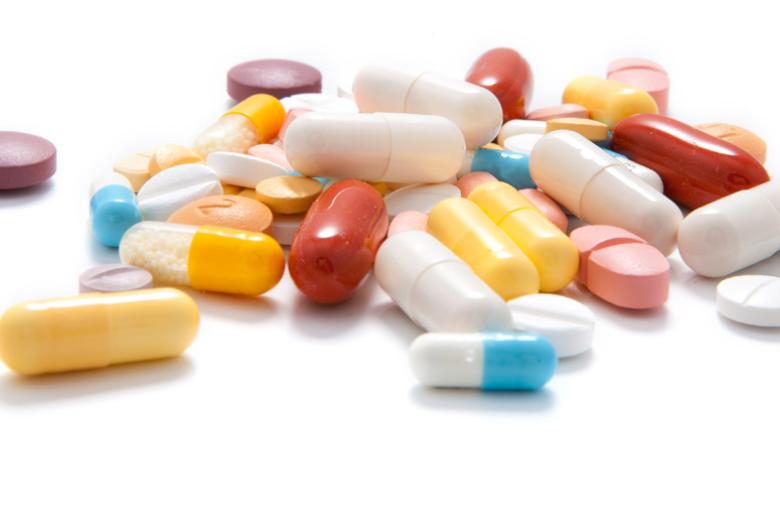 Various pills on a white surface