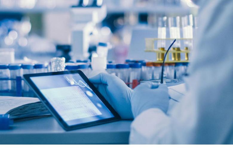 laboratory with scientist looking at a tablet computer