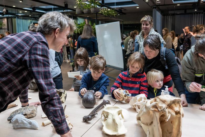 Children examining human and animal bones at a science event